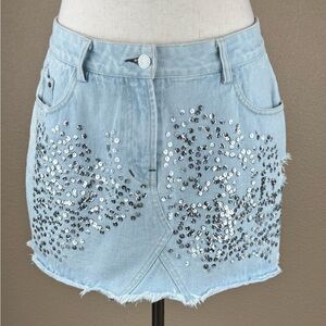Religion jean skirt with silver sequins. Light blue wash. Size M/12/40.